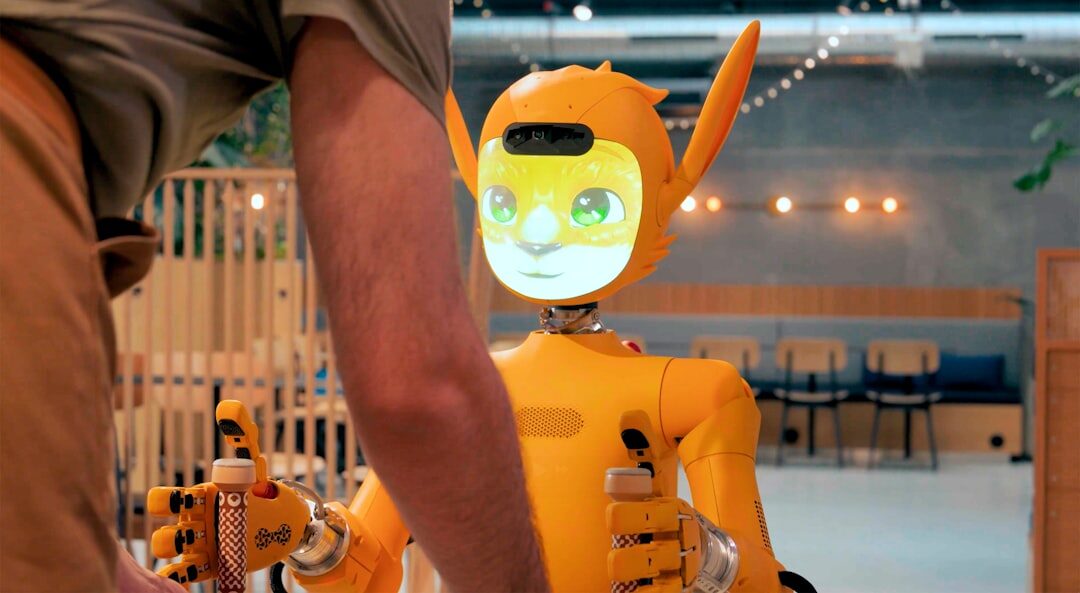 White humanoid robot with glowing blue eyes in a studio