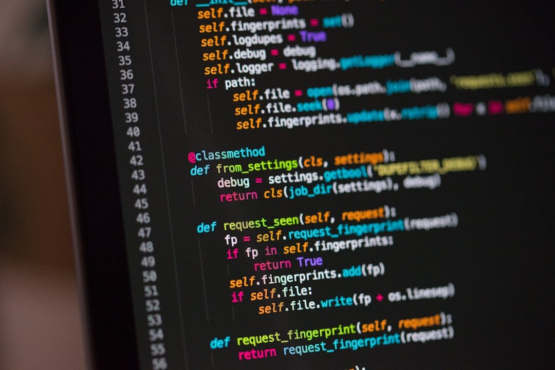 Laptop screen displaying colorful programming code syntax